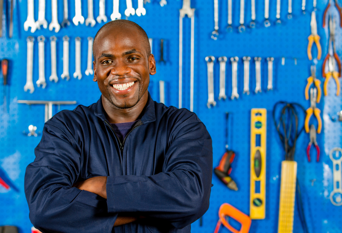Black mechanic smiling